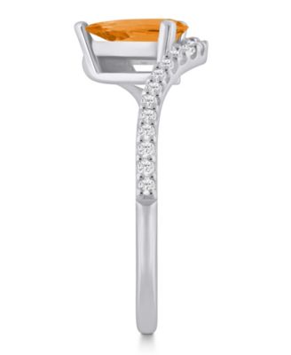 London Blue Topaz (1-1/20 ct. t.w.) and Diamond Ring (1/5 ct. t.w.) in 10k Yellow Gold