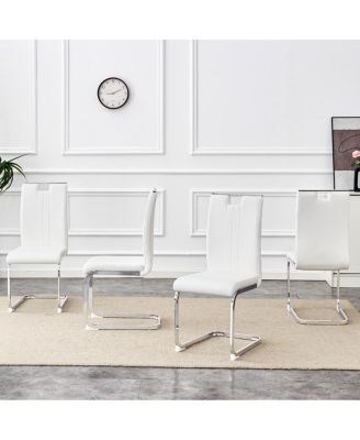 Set of 4 PU bow-shaped chairs for minimalist/contemporary homes.