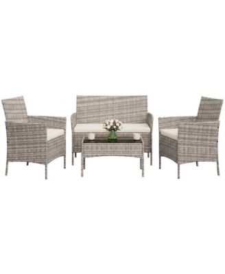 4-Piece Rattan Patio Furniture Set with Upholstered Sofa and Coffee Table