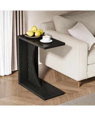 C-Shaped End Table beside sofa