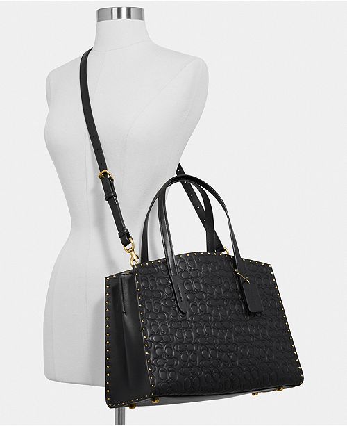 COACH Charlie Carryall in Signature Embossed Leather with Rivets ...