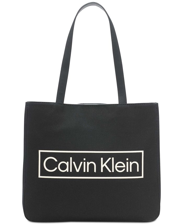 Buy the Calvin Klein White and Beige Canvas Tote Bag