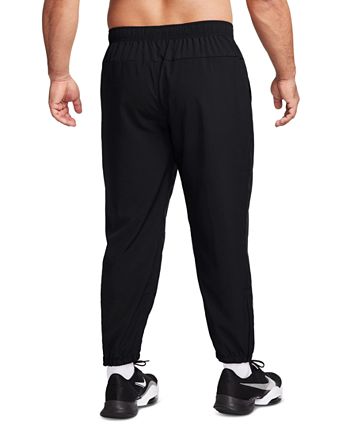 Nike sweatpants standard on sale fit tapered leg