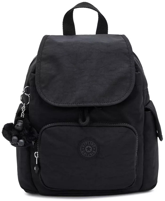 A black mini backpack with a monkey keychain on it