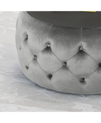 velvet design with diamond tufting and a tempered glass top is offered as a modern glam ottoman