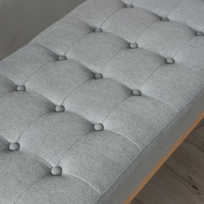 tufted upholstered design with mid-century modern charm is offered as a stylish bench