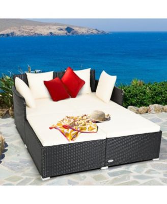 Spacious Outdoor Rattan Daybed with Upholstered Cushions and Pillows