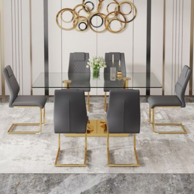 Table and chair set.Modern rectangular dining table with Transparent tempered glass tabletop and gold plated metal legs.Paired with 6 comfortable chairs with PU seats and golden metal legs.