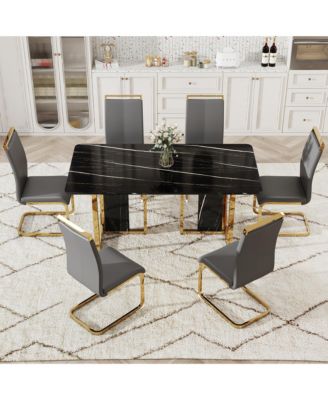 Table and chair set. Modern dining table with MDF top and beautiful MDF legs. Equipped with comfortable PU chairs and metal legs. Suitable for a wide range of decorative styles.