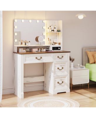 Vanity desk for bedroom with lights, drawers, shelves, stool, and mirror.