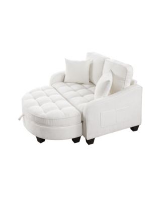 Beige two-seater sofa with chaise, storage footrest, and throw pillows