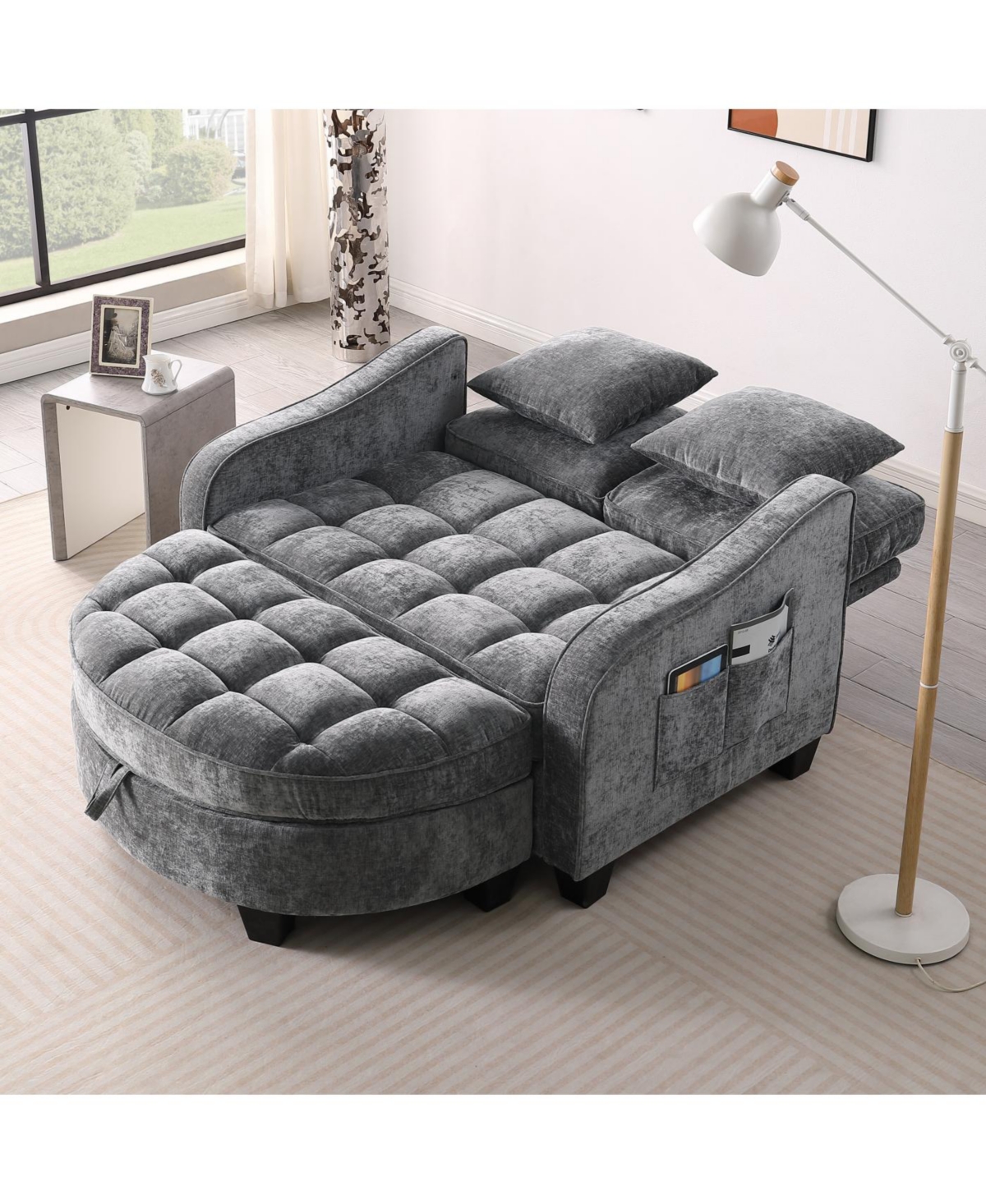 Streamdale Furniture Grey two-seater sofa with chaise, storage footrest, and two pillows