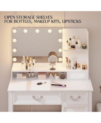 Vanity desk for bedroom with lights, drawers, shelves, stool, and mirror.