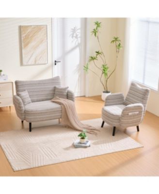 Modern two-seater sofa with armrests, pillows, and storage pockets.