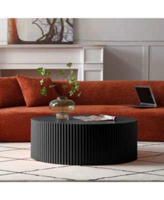 Sleek and Modern Round Coffee Table with Eye-Catching Relief Design Black