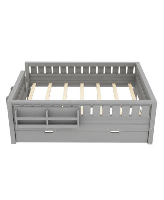 Full bed with bookshelves, staircase, safety rails, trundle