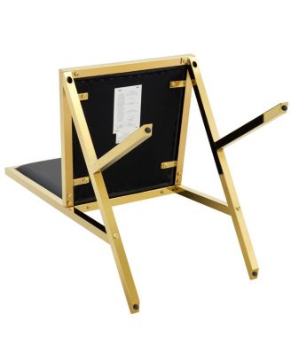 4-pack gold metal framed black PU dining chairs with ergonomic design.