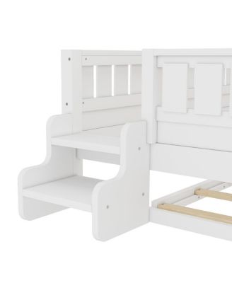 Full bed with bookshelves, staircase, safety rails, and trundle