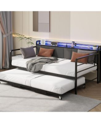 twin daybed with pop-up trundle, linen upholstery, storage headboard with charging ports, LED lights, and durable metal frame