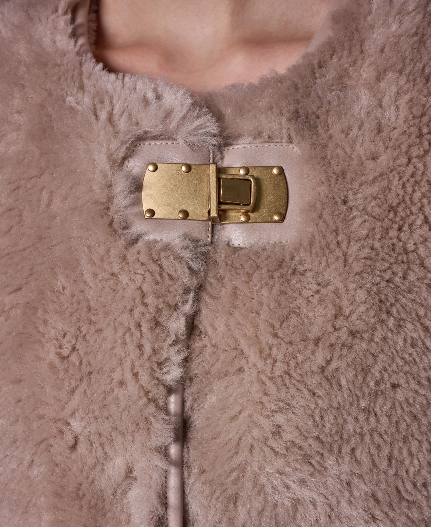 Women's Collarless Buckled Leather Coat