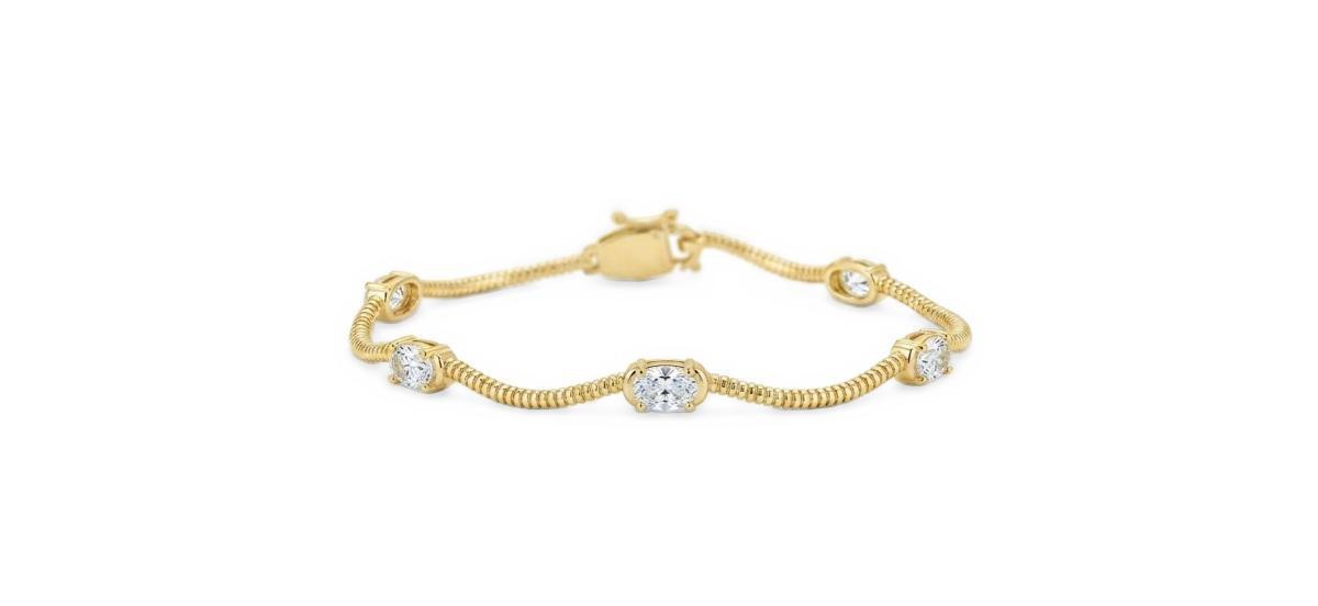 Etoielle Gold-Tone Oval Cubic Zirconia Fluted Wave Bracelet, 7" - Gold