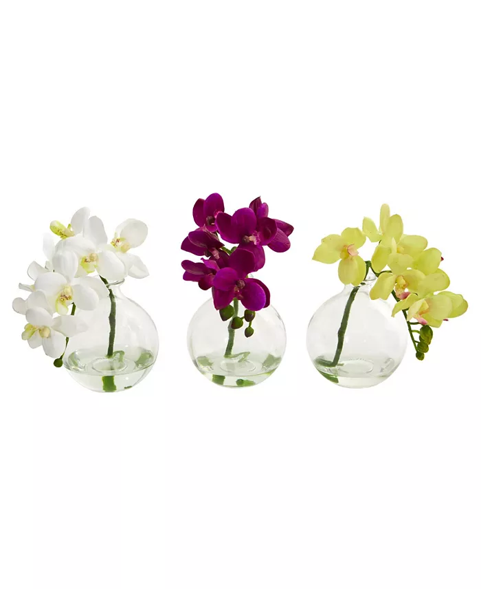 Three round vases with fake orchids in them