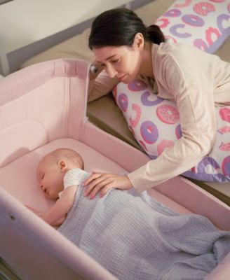 on bed bassinet