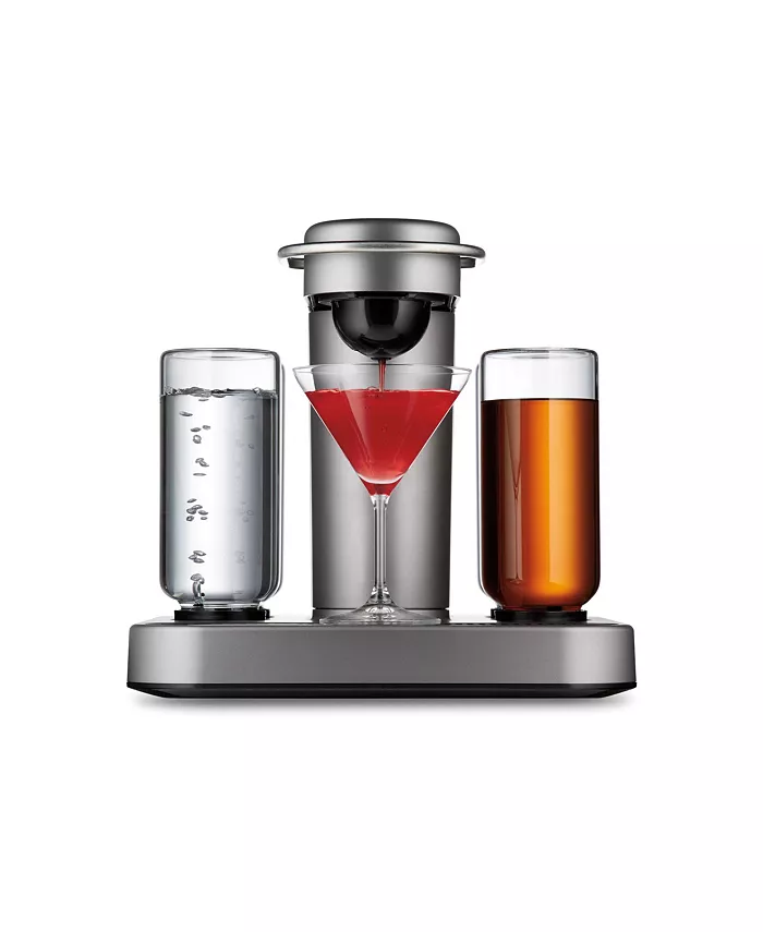A silver and black cocktail making machine with two jars of liquid and a martini glass on it