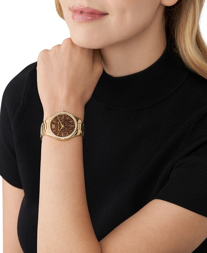 Michael Kors gold watch and Accessory Concierge bracelet, and