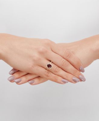 Garnet (2-1/4 ct. t.w.) & Diamond (1/8 ct. t.w.) Halo Ring in 14k Gold