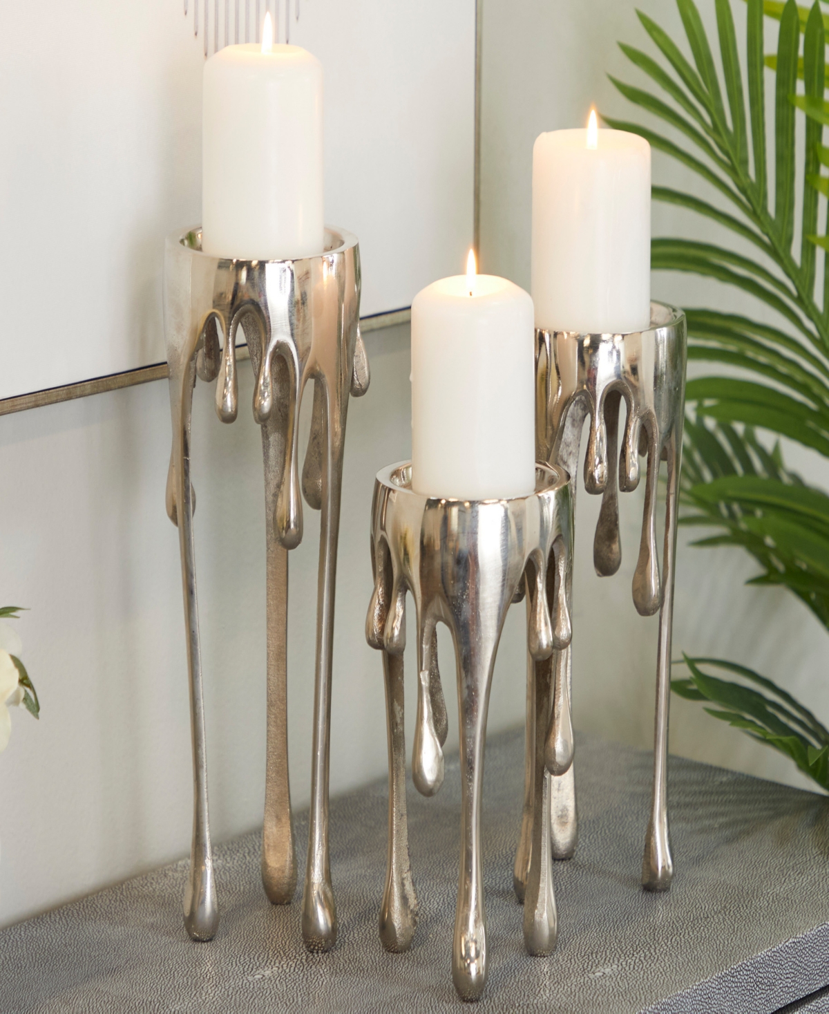 Shop Cosmoliving Aluminum Abstract Pillar Drip Candle Holder With Melting Designed Legs Set Of 3 In Silver
