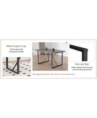 Table and chair set, textured top in vintage retro grey wood grain desktop, black metal legs. Dining chair with white faux leather backrest cushion with black metal legs.