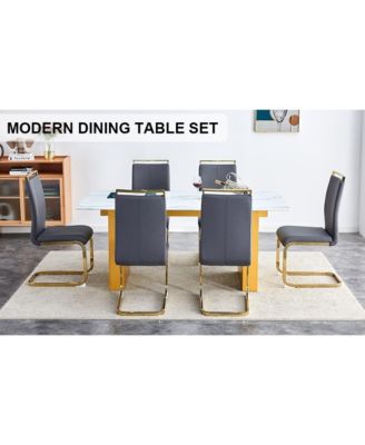Simplie Fun Table and chair set.Large modern rectangular table with 0.4 inch patterned glass tabletop and large MDF table legs.Comes with 6 chairs with faux leather cushioned seats and golden metal legs