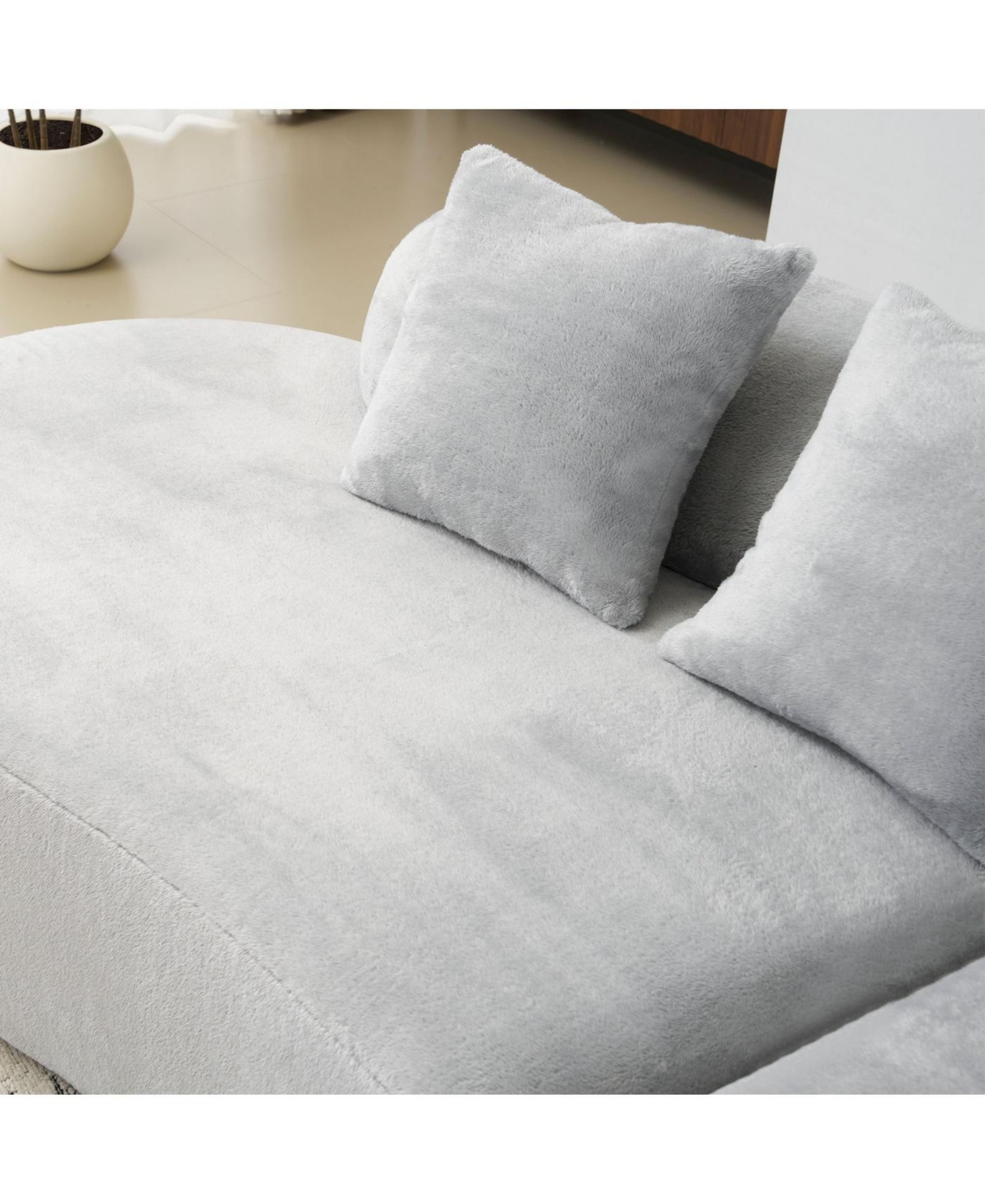 Streamdale Modern curved flannelette sofa with pillows in light gray.