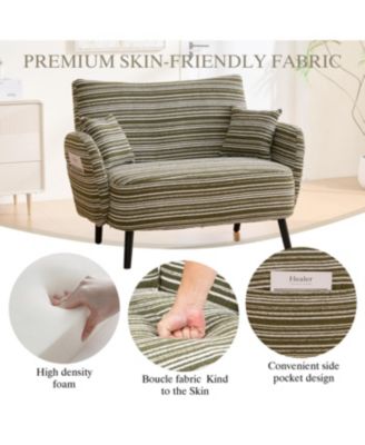 Modern two-seater sofa with armrests, pillows, and storage pockets.