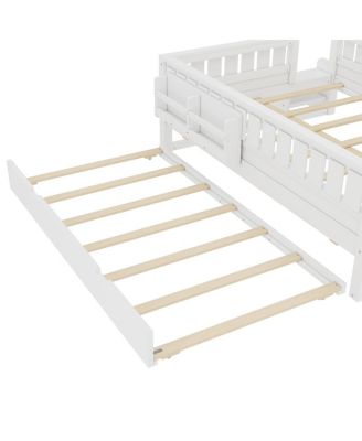 Full bed with bookshelves, staircase, safety rails, and trundle