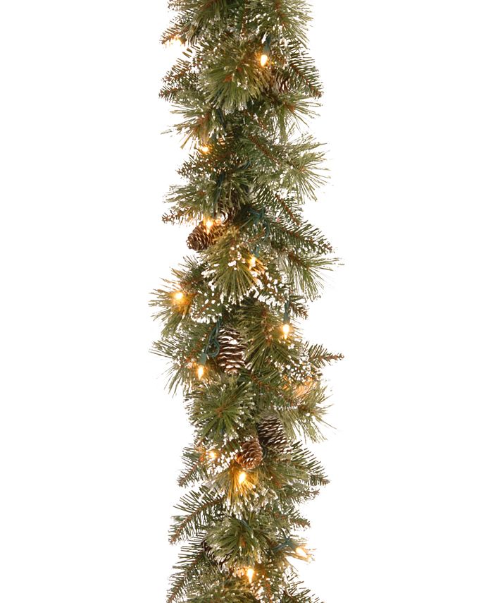 National Tree Company - Glittery Bristle Pine Garland with Cones & 50 Battery Operated LED Lights Product Description