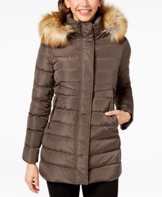 black puffer coat with brown fur hood