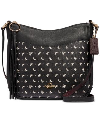 black coach bag with butterflies