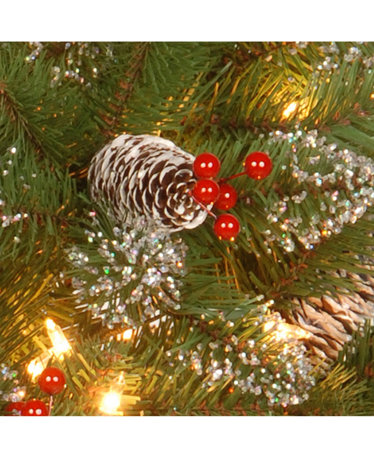 National Tree Glittery Mountain Spruce Wreath with White Edged Cones, Red Berries and 50 Warm White Battery Operated Led Lights with Timer