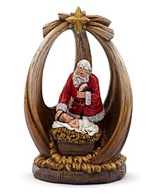 Santa with Baby Jesus in Creche