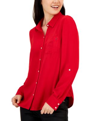 red sleeveless button up shirt