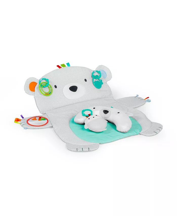 A play mat shaped like a polar bear with accessories