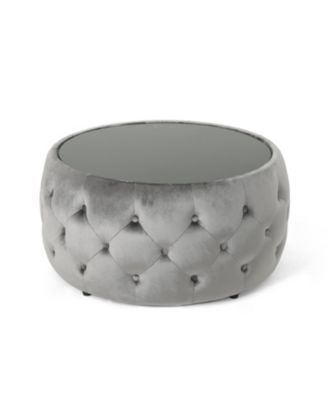 velvet design with diamond tufting and a tempered glass top is offered as a modern glam ottoman