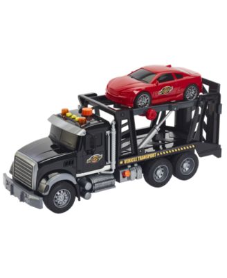 Fast Lane by fashion Toys r us light and sound tow truck with racecar on back.