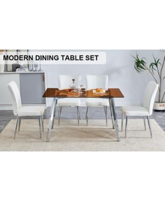 Table and chair set. Large modern rectangular table with brown glass top and silver metal legs. It comes with soft and comfortable PU seats, faux leather upholstered seats and silver metal legs.