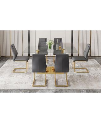 Table and chair set.Modern rectangular dining table with Transparent tempered glass tabletop and gold plated metal legs.Paired with 6 comfortable chairs with PU seats and golden metal legs.