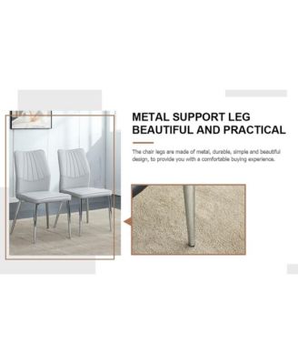 Table and chair set.Contemporary, minimalist rectangular dining table featuring a clear tempered glass top and sleek silver legs. Paired with chairs made of PU material cushion and silver metal legs.