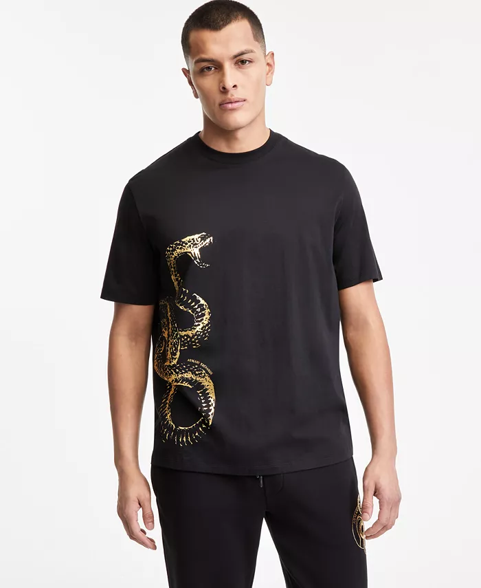 A man wearing a black shirt with a gold snake on it