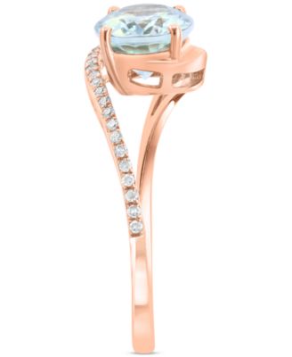 EFFY&reg; Aquamarine (1-1/2 ct. t.w.) & Diamond (1/20 ct. t.w.) Oval Twist Ring in 14k Rose Gold